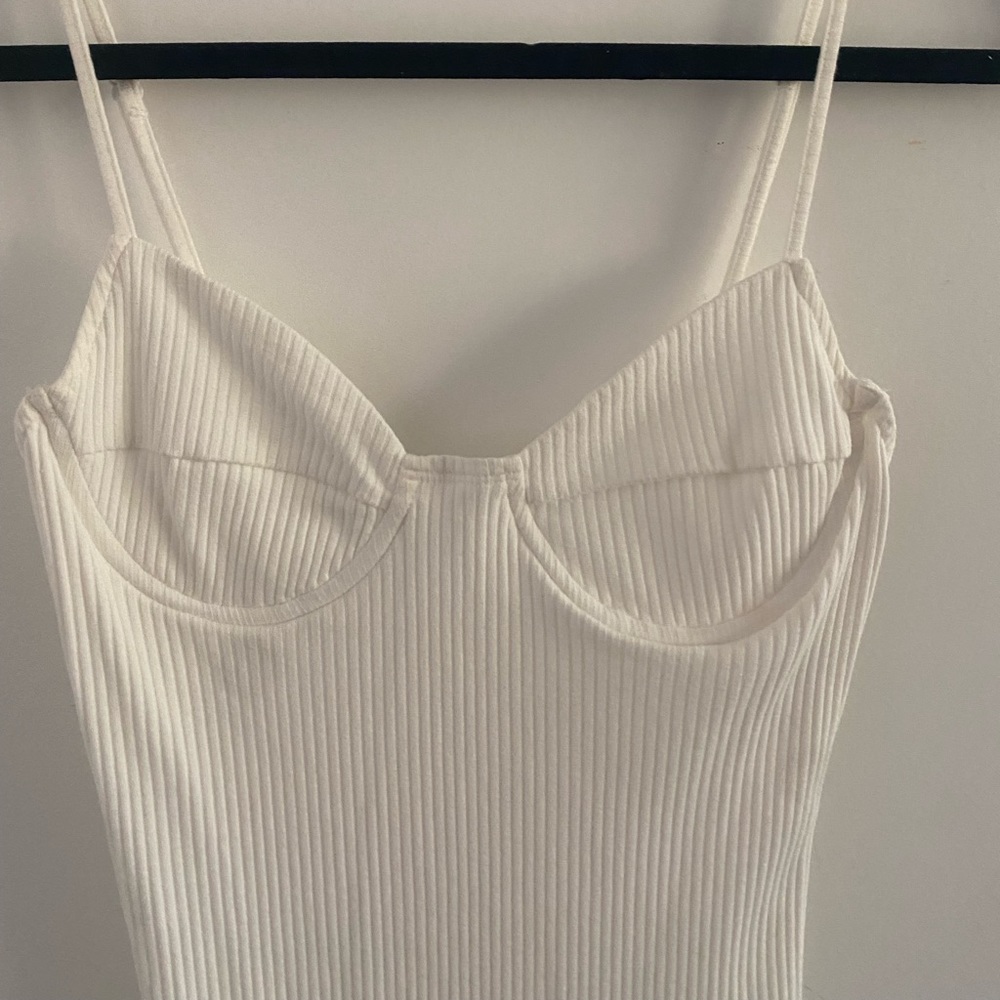 White ribbed body con dress. Wire bra cups. Adjustable straps. Never worn.